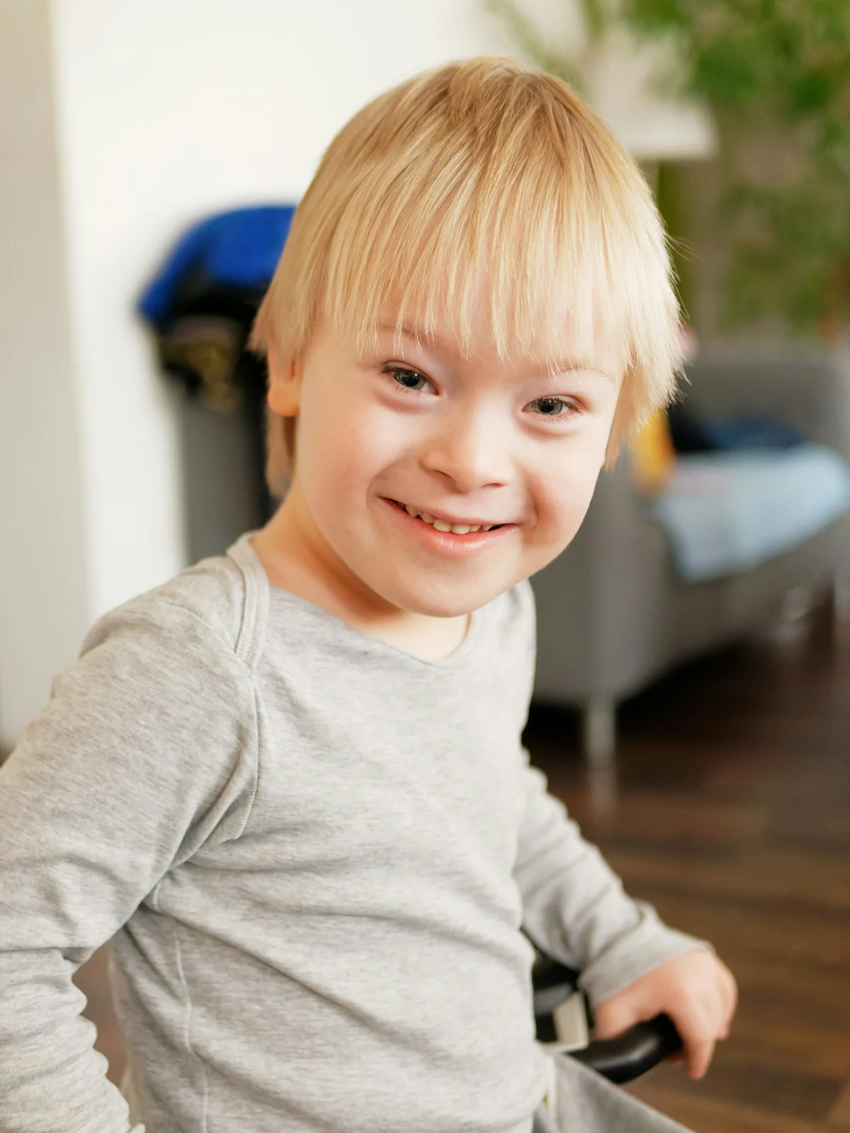 Young child smiling, representing the importance of documenting meetings for special education advocacy