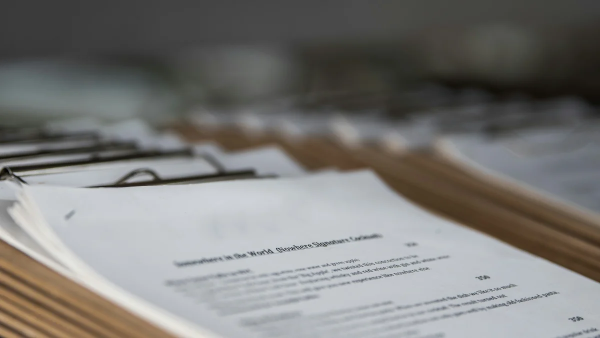 Professional consultation with documents and notes on table during a meeting
