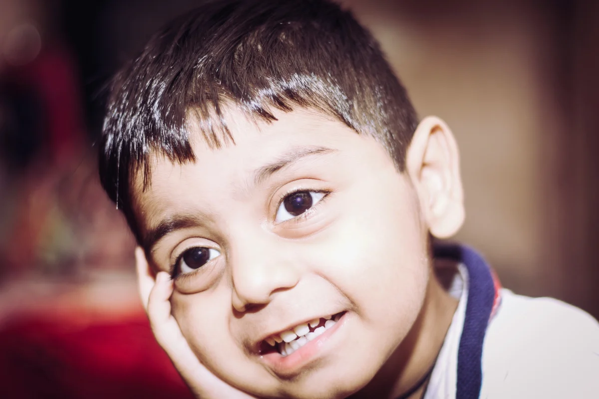 Young boy smiling, representing hope and advocacy for children with IEPs