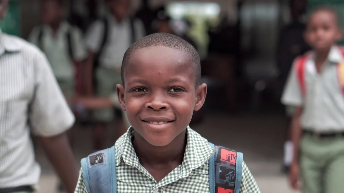 Child with blue backpack representing school transition and IEP portability
