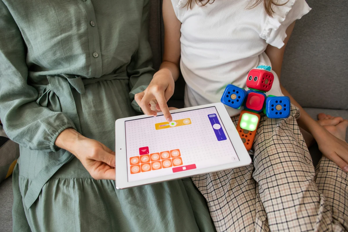 Mother and daughter reviewing educational materials together at a desk