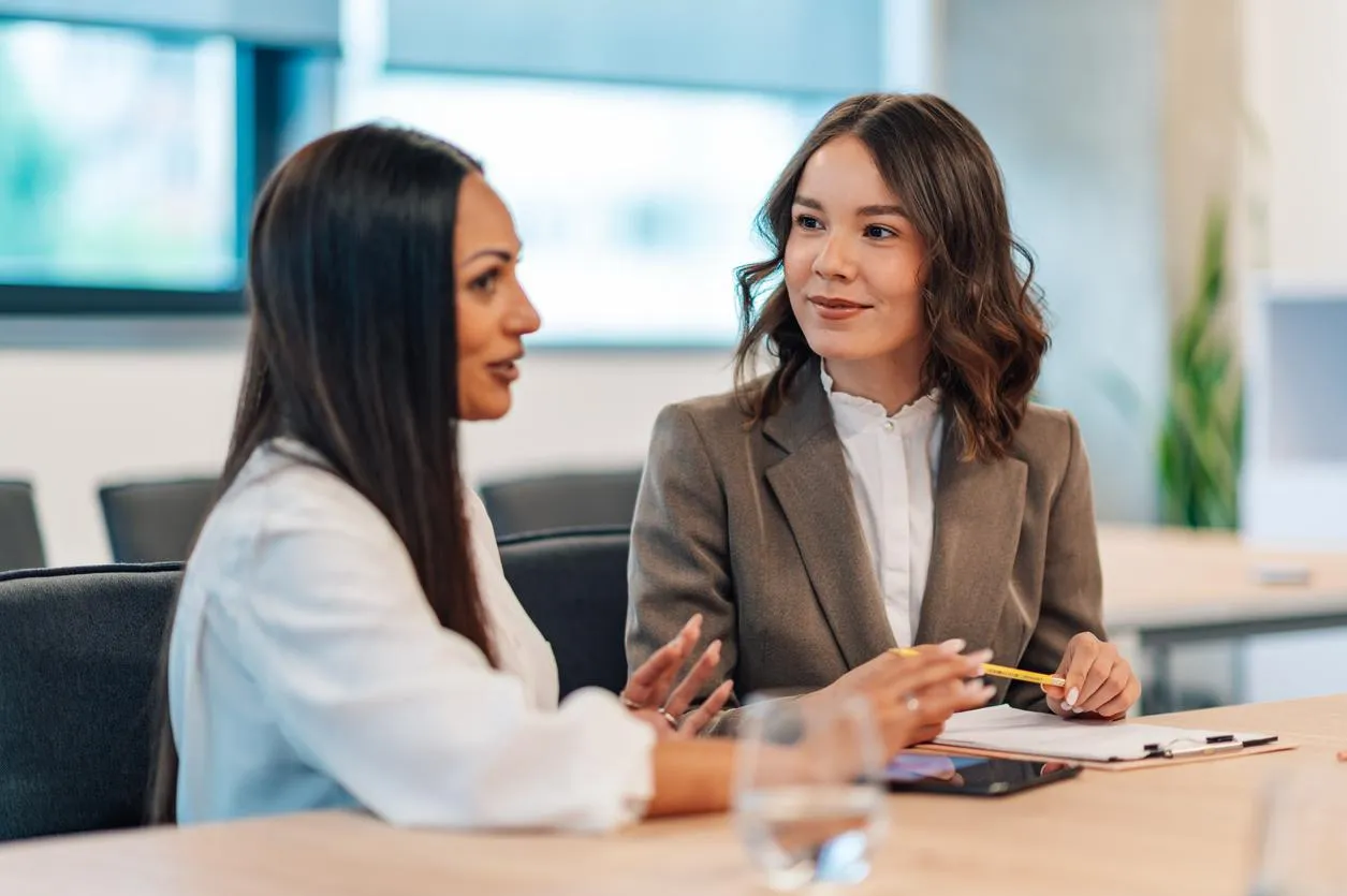 Special education advocate consulting with a parent about their child's IEP